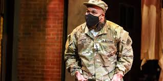 Pittsburgh Opera performer dressed as a soldier and wearing a mask.