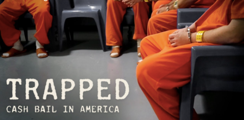 Photo of people from the waist down, seated, wearing orange jail jumpsuits and handcuffs; text: Trapped - Cash Bail in America