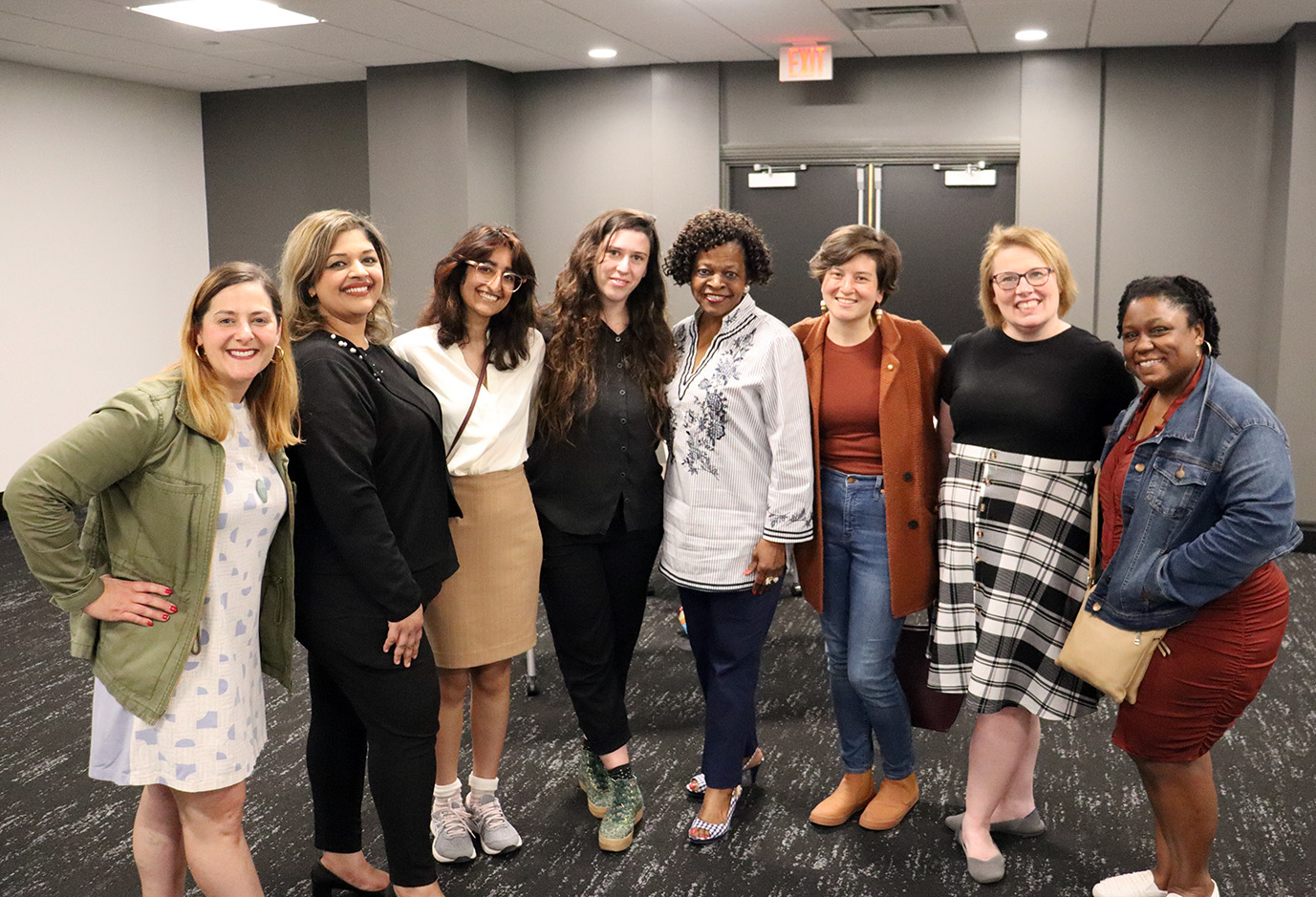 Pictured: Gina Evans, Monica Malik, Vidya Surti, Marina Balko, Natalie Sweet, Teresa Trich and Ishara Henry