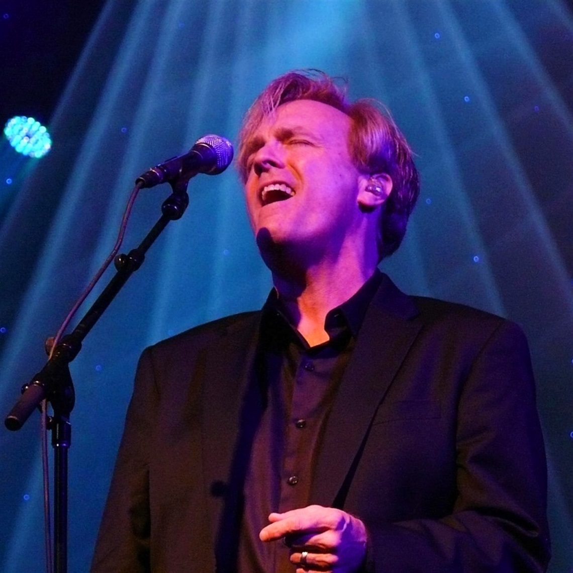 Photograph of Jeff Jimerson singing on stage