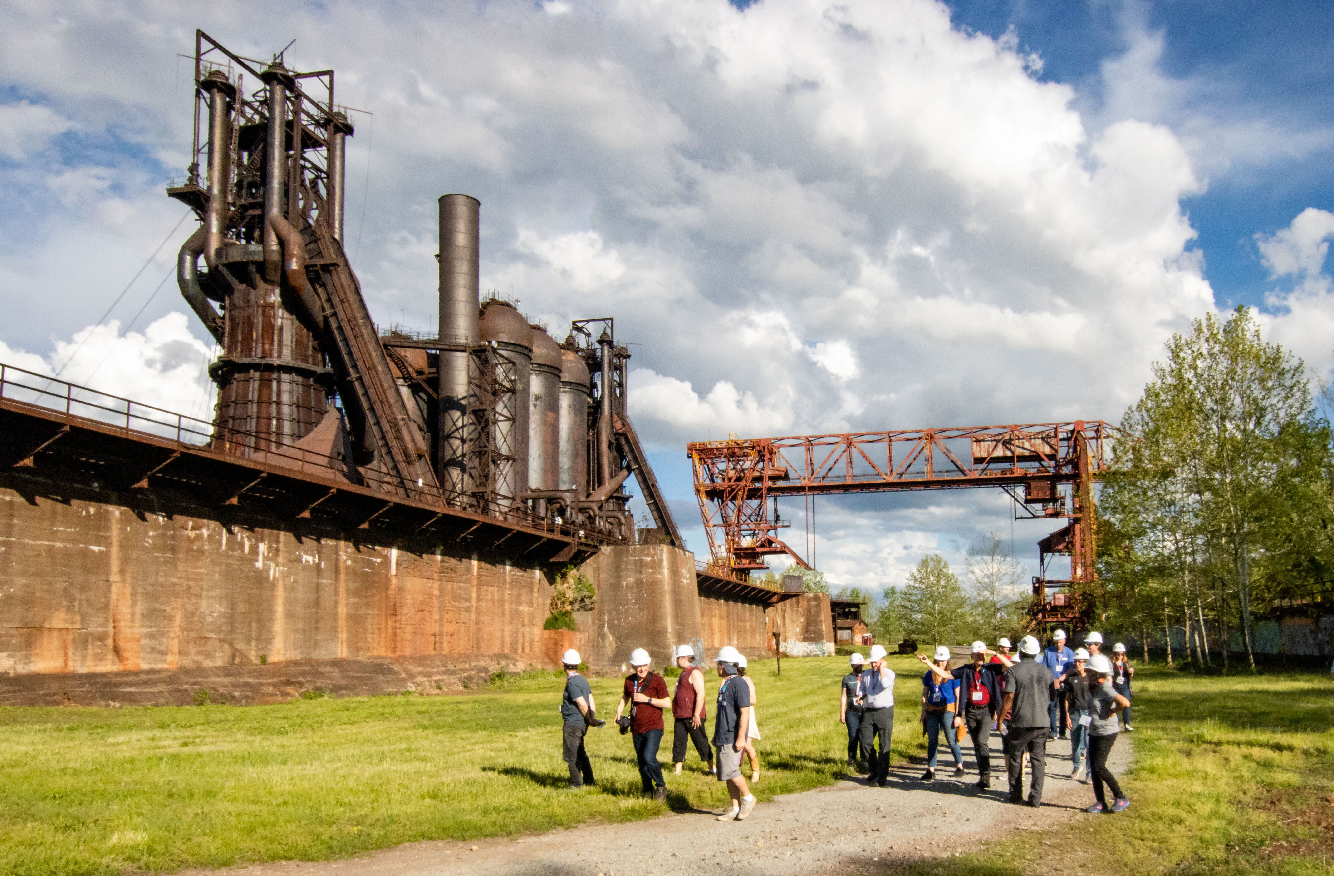 Photo of guests walking past the Carrie Blast Furnaces.