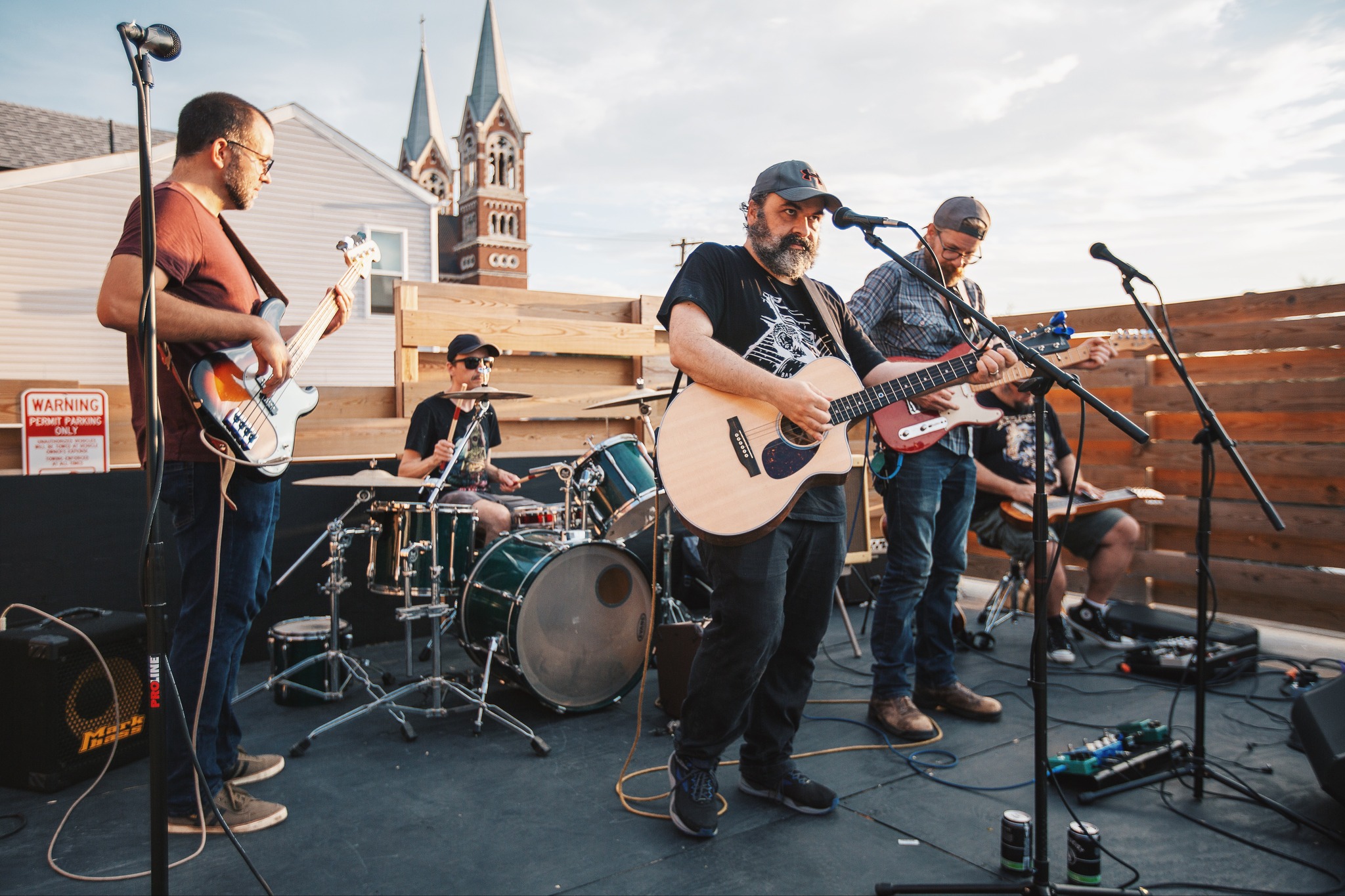 Photograph of the Beagle Brothers, a rock band playing on a roof